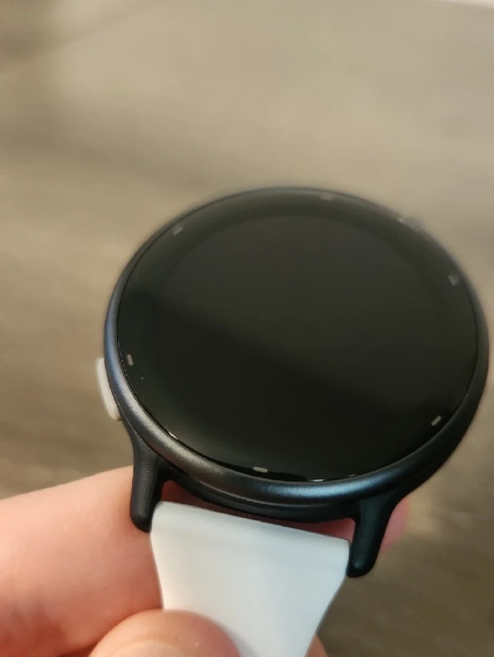 garmin white silicone smartwatch with black watch face